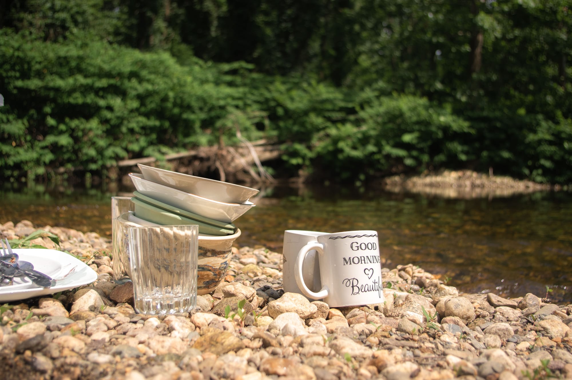 Collection of dish ware sitting by the mill river