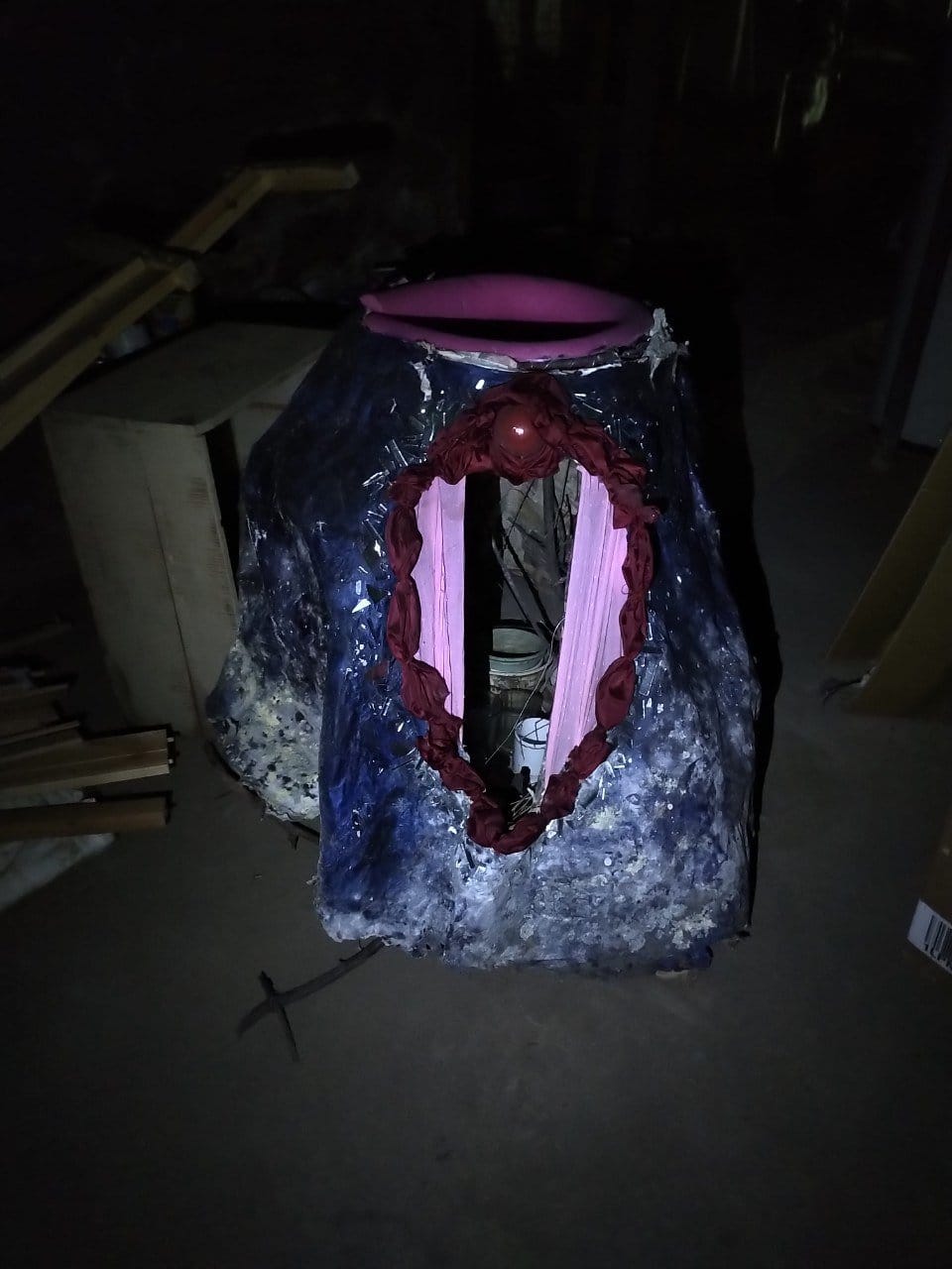 a paper mache vulva with visible sticks inside