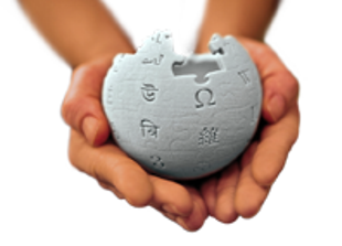 Wikipedia logo held in hands